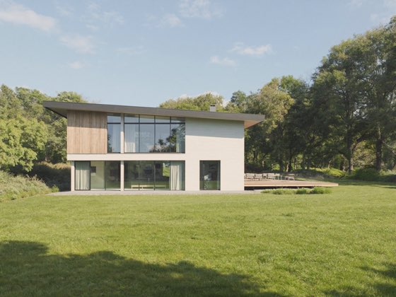 Ebenerdiges Haus mit flachem Dach und großen Fenstern